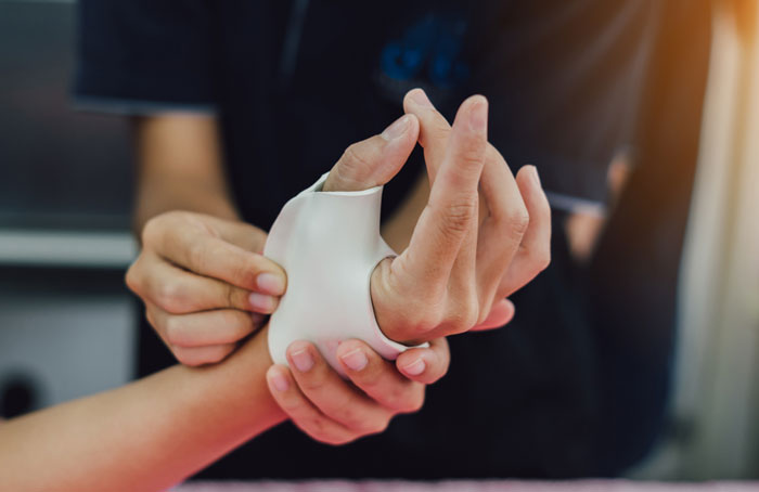 Casts and splints aim to restrict movement at the injured portion of the wrist, hand, or finger and are fabricated to minimise interference with the rest of the hand